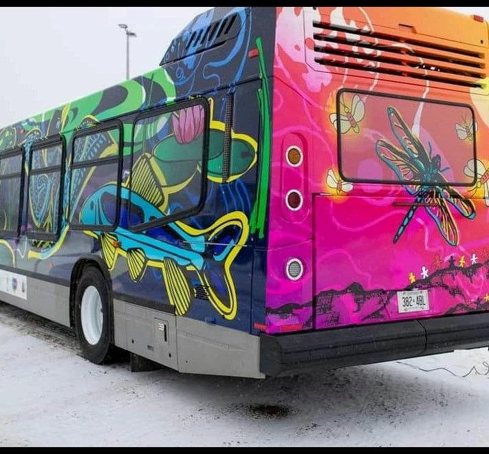 Bus with colorful mural of fish and dragonflies