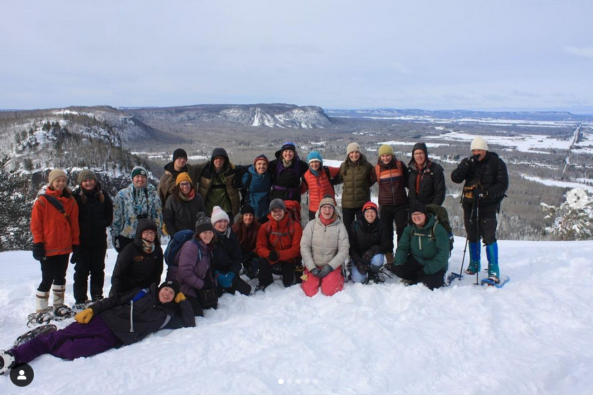 22 people on a snowy hike overlooking a mesa (Nor'wester) outside Thunder Bay